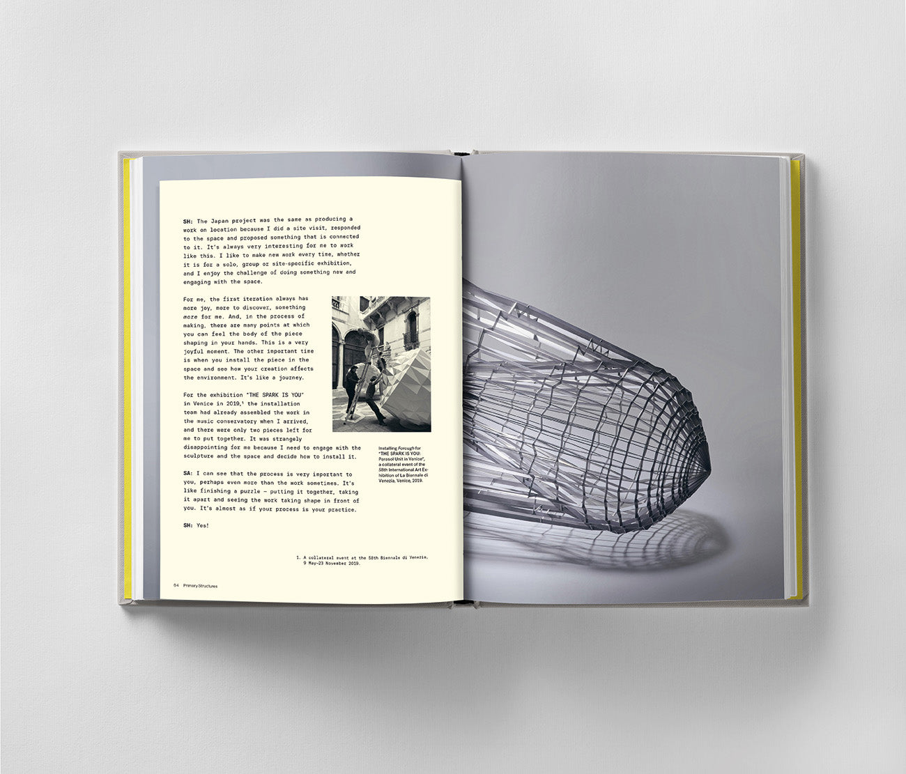 The book "Sahand Hesamiyan: Primary Structures" by Black Dog Online shows a page with text and a small black-and-white photo on the left, and an abstract sculpture drawing on the right, reminiscent of Hesamiyan's metal sculptures influenced by Islamic and Persian architecture.