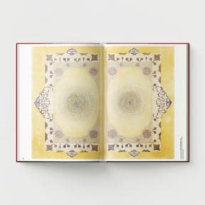 An open book titled "Ambreen Butt: What Comes to My Lips" by Black Dog Online, showcasing an intricate geometric design with symmetrical patterns reminiscent of Indo-Persian miniature painting, and featuring a yellow and beige color palette.