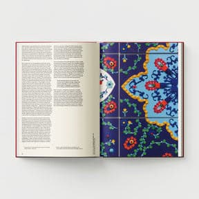 An open book displays text on the left page, while the right page features a detailed and vibrant design inspired by Indo-Persian miniature paintings from Ambreen Butt's "What Comes to My Lips," offered by Black Dog Online.