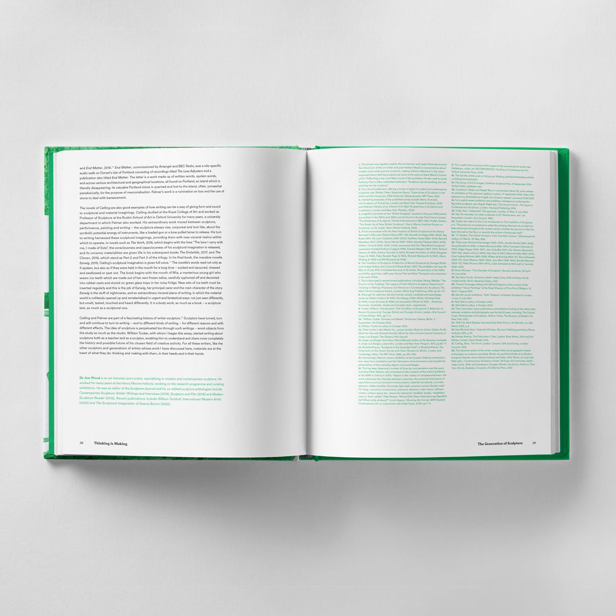 An open copy of "Thinking is Making: Objects in Space The Mark Tanner Sculpture Award" by Black Dog Online with a green cover lies on a white surface. The left page contains a block of text, while the right page features two columns, likely discussing contemporary sculptural practice and emerging sculptors competing for the Mark Tanner Sculpture Award.