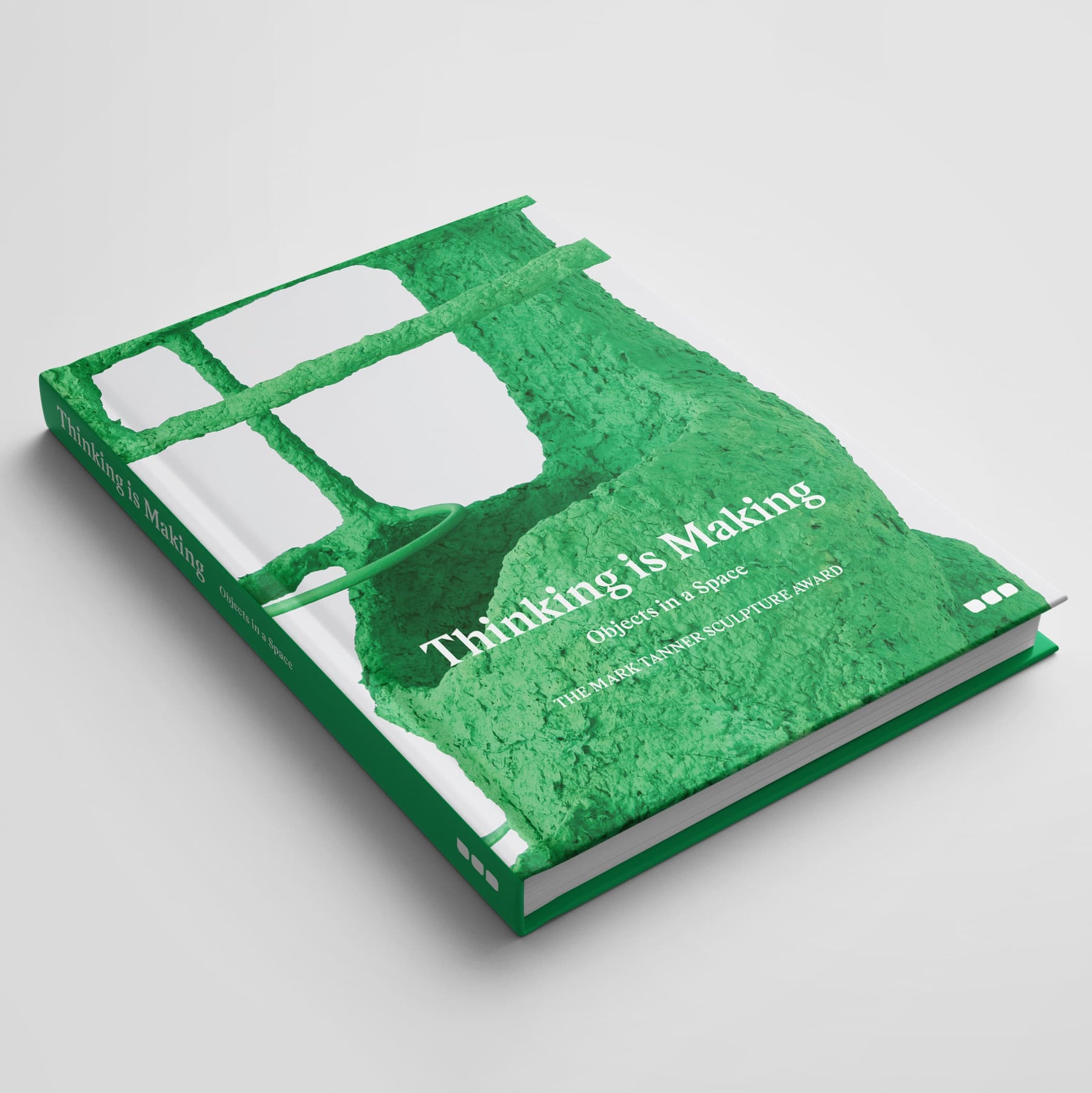 A hardcover book titled "Thinking is Making: Objects in Space The Mark Tanner Sculpture Award," featuring a green cover with a textured abstract design, showcasing the works of emerging sculptors and contemporary sculptural practice associated with Black Dog Online.