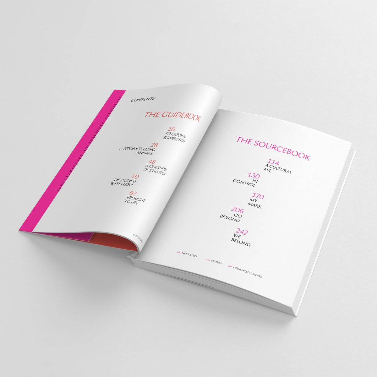 Open book titled "The Experience Book: For Designers, Thinkers & Makers" by Black Dog Online with visible contents pages showing chapter titles and page numbers. The interior text and layout, influenced by design theory, are styled in black and pink. Perfect for experience designers, this resource offers invaluable insights.