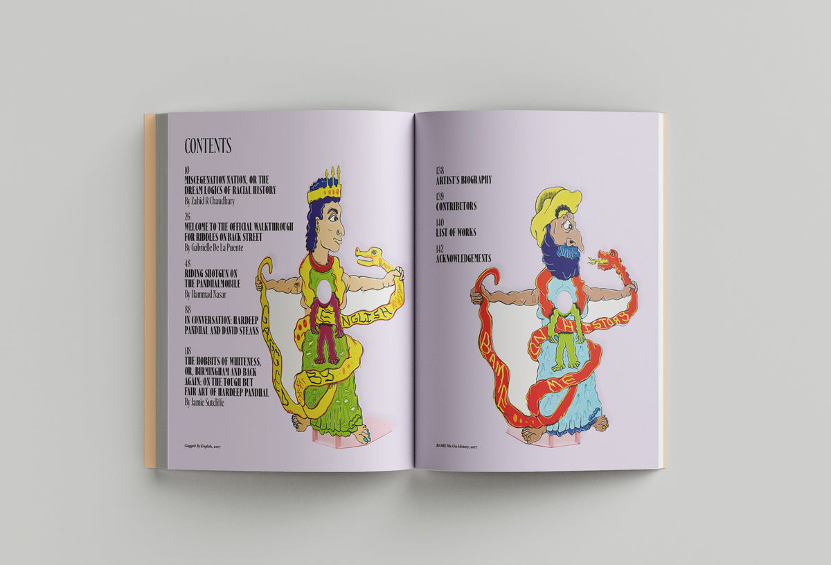 Open book displaying two colorful drawn characters on opposite pages. The left character wears a crown and robe while holding a snake, while the right character, reminiscent of Hardeep Pandhal's art inspired by Sikh heritage, wears a hat and beard, also holding a snake. The book is titled "Hardeep Pandhal: Inheritance Quest" by Black Dog Press.