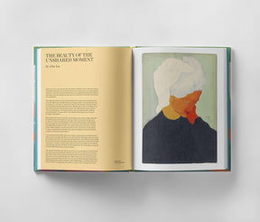 An open copy of "March Avery: A Life in Color" by Black Dog Online reveals an exquisite oil painting by March Avery of a person wearing a white headscarf on the right page, while the left page features an article titled "The Beauty of the Unshared Moment" by John Yau, exploring emotional depth in art.