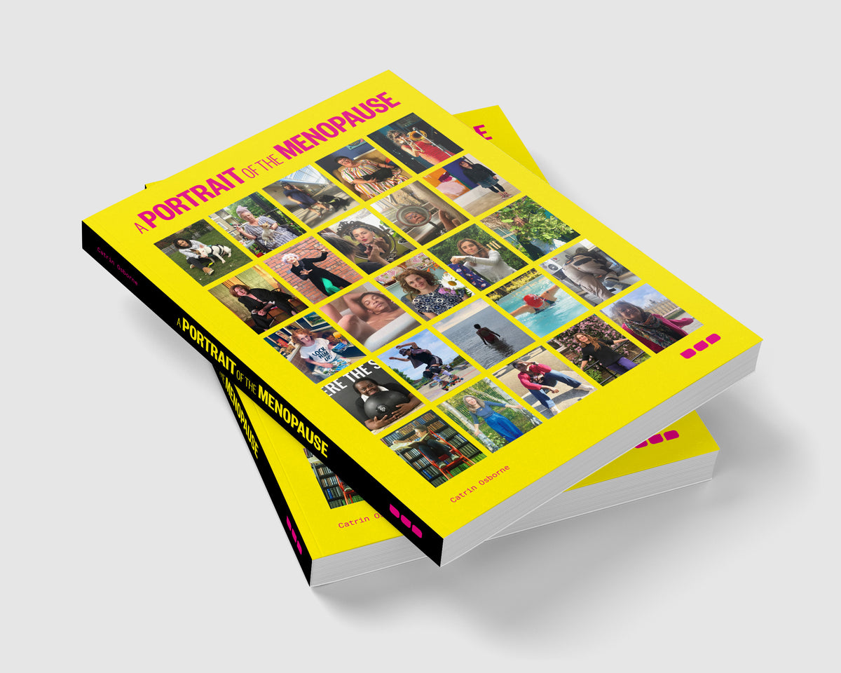 A stack of "A Portrait of Menopause" books by Black Dog Press, with yellow covers featuring a grid of photographic portraits, celebrating women’s health and diverse experiences.