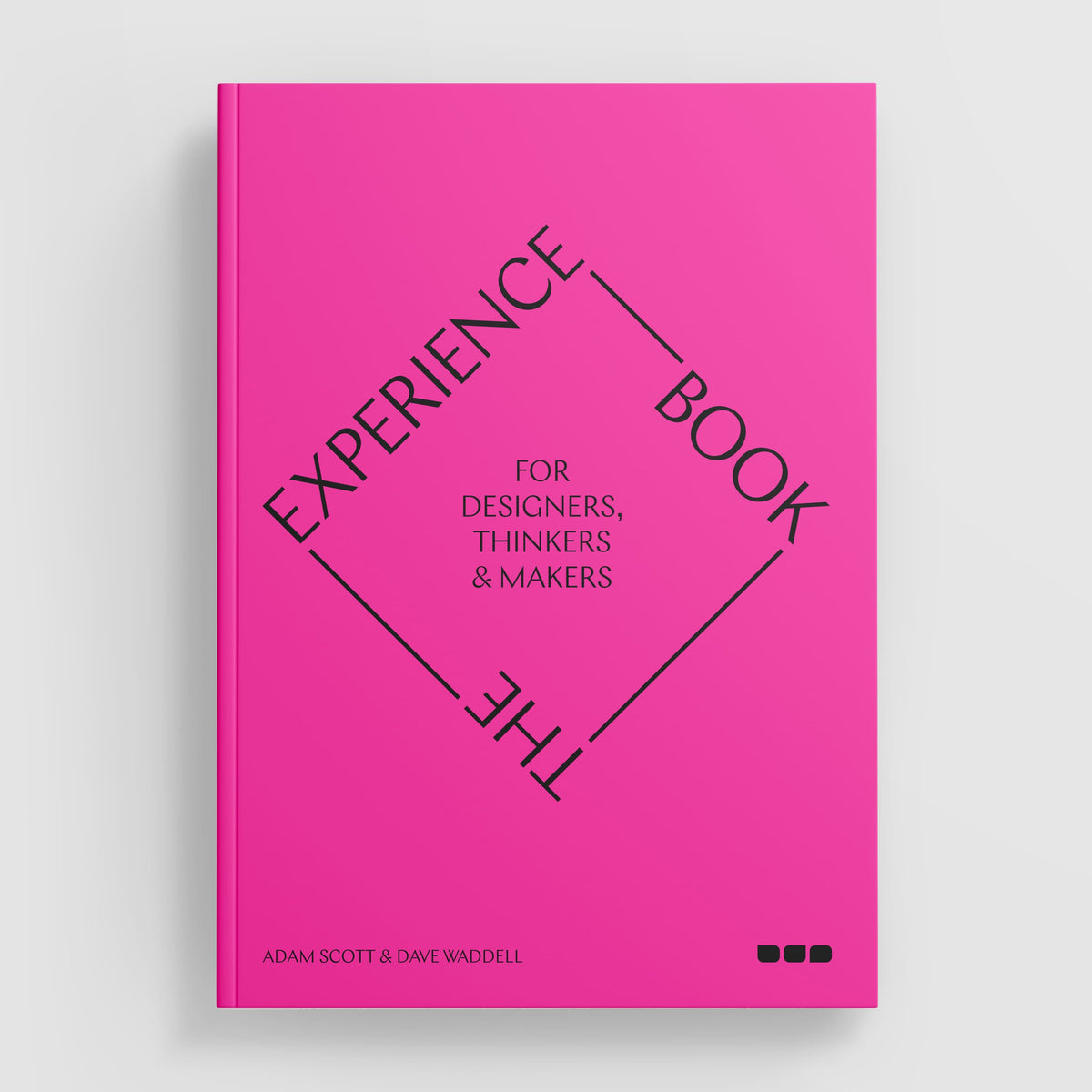 Bright pink book cover titled "The Experience Book: For Designers, Thinkers & Makers" by Adam Scott and Dave Waddell. The title, arranged in a diamond shape, delves into design theory tailored for experience designers. Published by Black Dog Online.